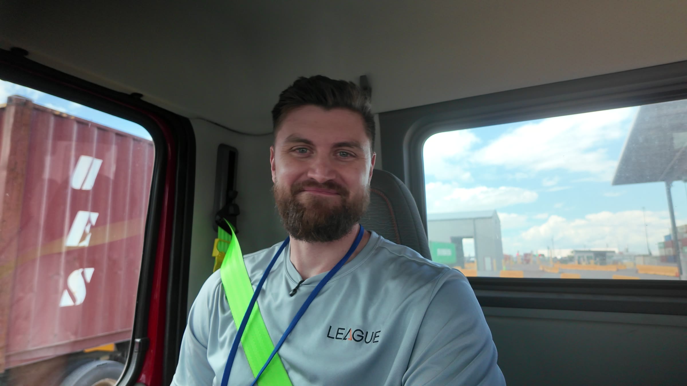 Robert Wiederhold in a League shirt, riding in a League truck at the Port of Tampa.